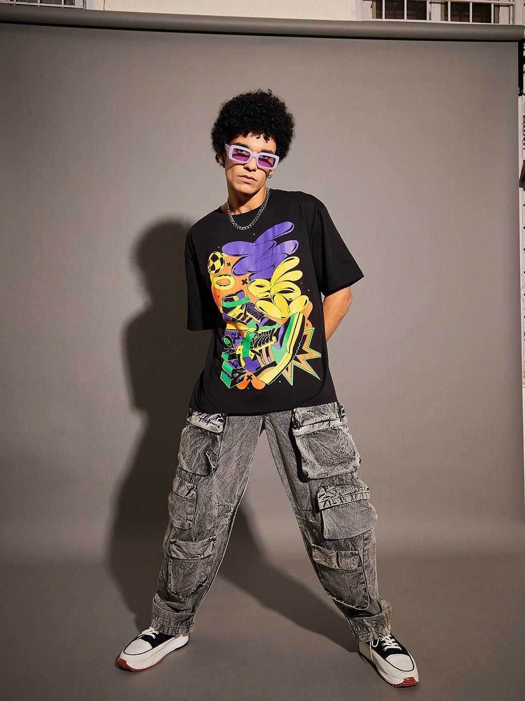 Unisex Black Graphic Printed Pure Cotton Oversized T-shirt – Trendy Streetwear for Men & Women in Pakistan | DENIMS