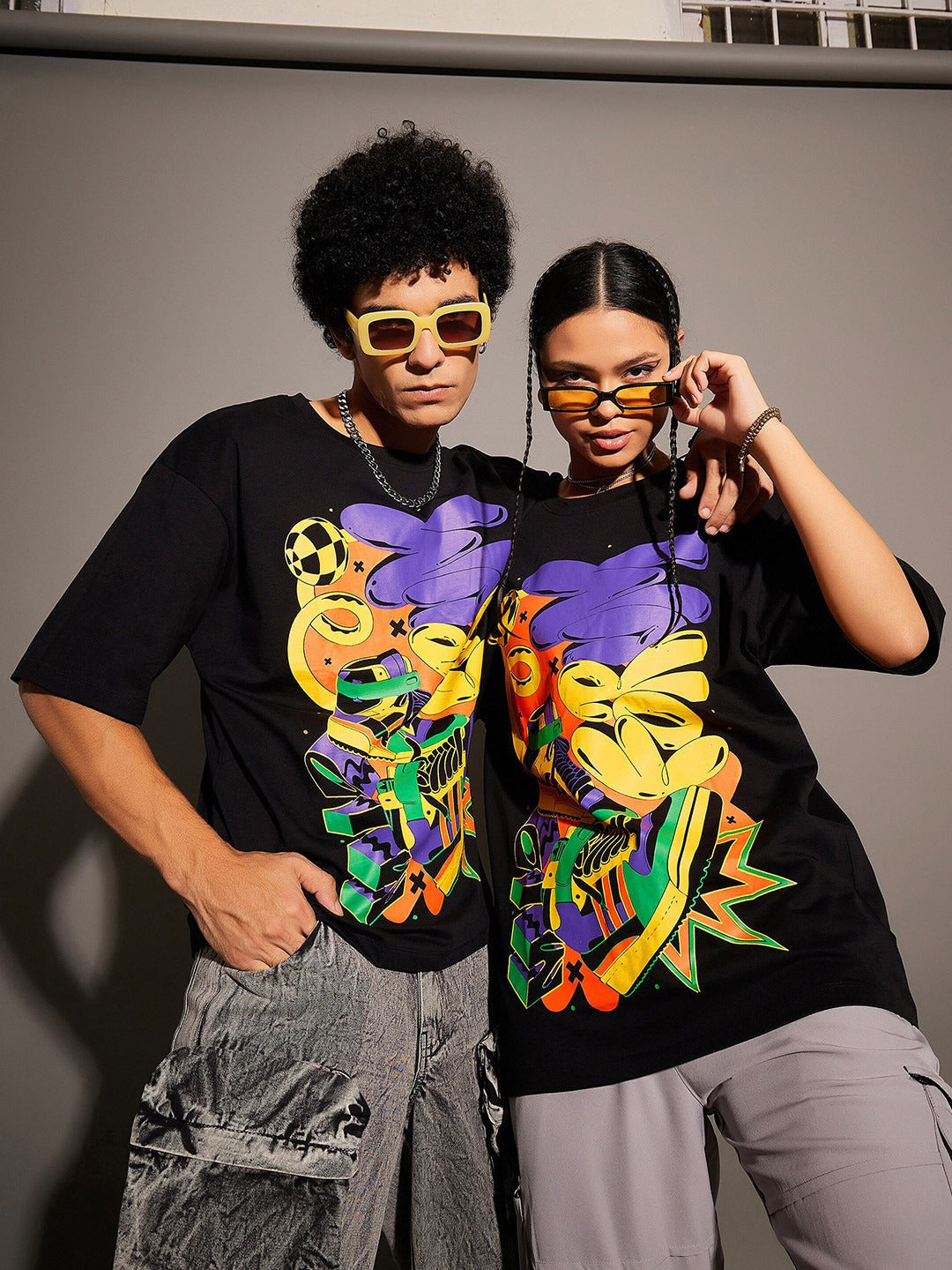 Unisex Black Graphic Printed Pure Cotton Oversized T-shirt – Trendy Streetwear for Men & Women in Pakistan | DENIMS