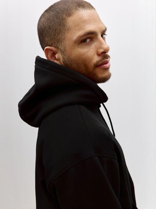 Men Black Relaxed Fit Hoodie – Comfortable Streetwear Style in Pakistan | DENIMS